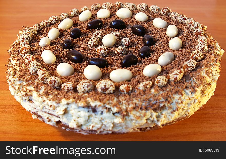 The celebratory ornate chocolate cake on a table