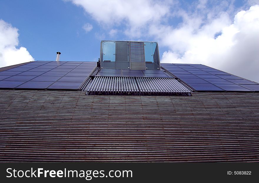 Green energy generated from solar panels or photovoltaic and water heated by the sun, all located on the roof. Green energy generated from solar panels or photovoltaic and water heated by the sun, all located on the roof