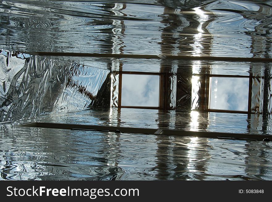 Light spread through the inside of a three storey building by using highly reflective material in the light well. Light spread through the inside of a three storey building by using highly reflective material in the light well