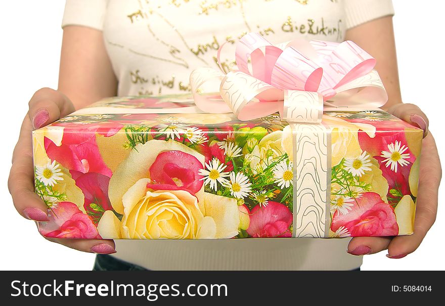 Female hands on a white background hold a box with a gift. Female hands on a white background hold a box with a gift
