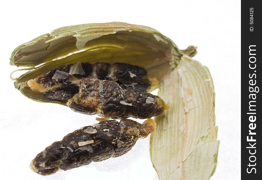 Split cardamom pod showing seeds