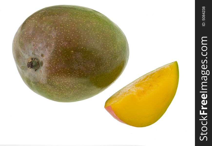 Juicy mango slice isolated against white background with whole mango. Juicy mango slice isolated against white background with whole mango