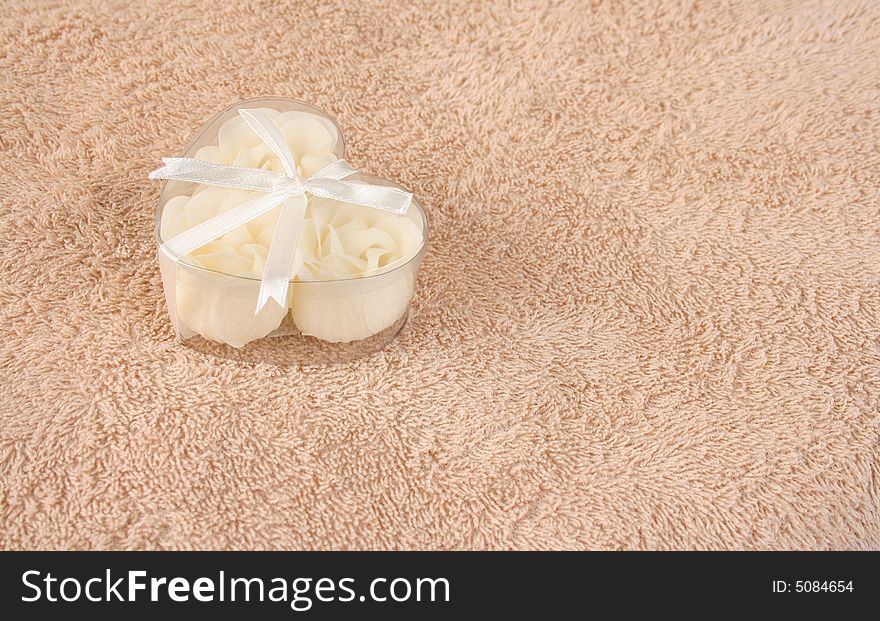 Beige flowers made out of Soap in a heart shaped box. Beige flowers made out of Soap in a heart shaped box