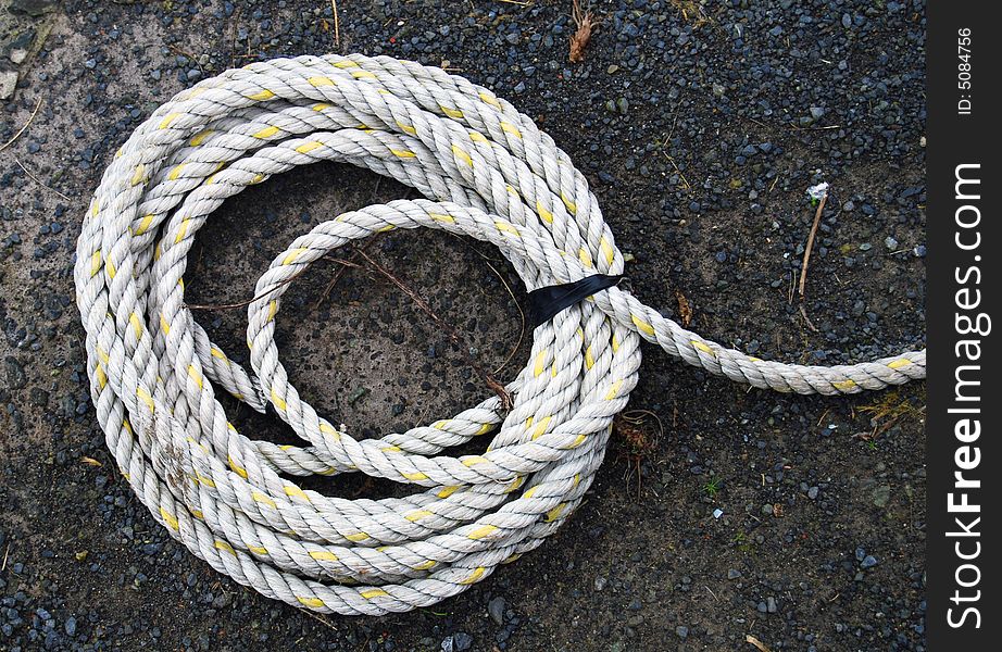 Coiled rope on gravel