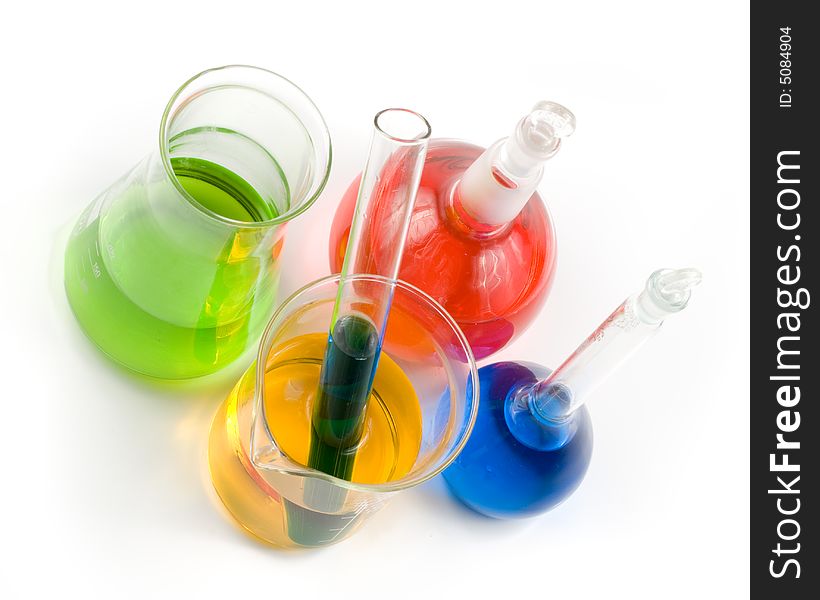 Various colorful flasks over white background