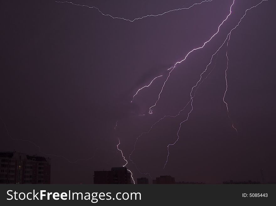 Several bolts of lightning over the city.