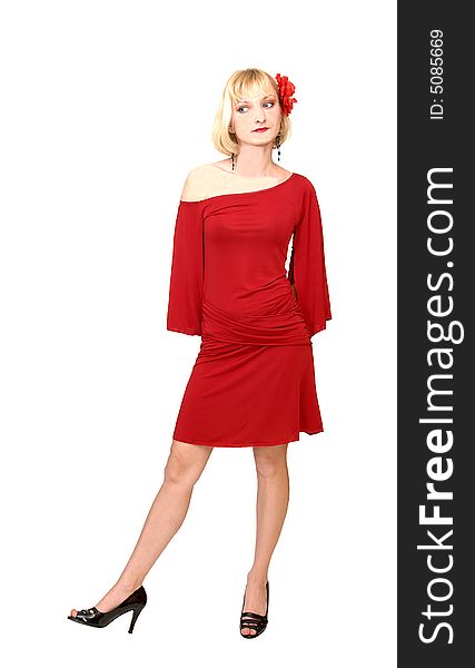 An friendly blond girl in an short red dress standing in an studio 
for white background with a red flower in her hair. An friendly blond girl in an short red dress standing in an studio 
for white background with a red flower in her hair..