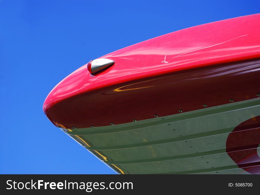 Reflection at an old ariplane with blue sky