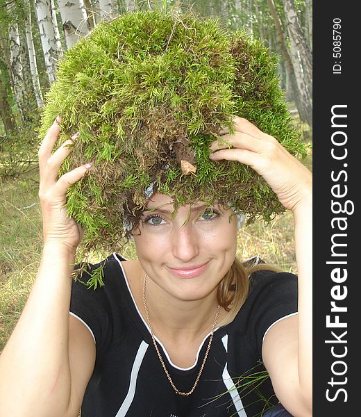 Girl with a moss on a head. Girl with a moss on a head