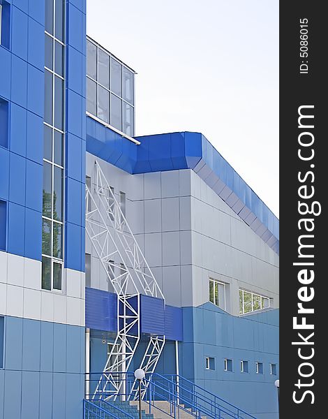 New multistoried building on a background blue sky, social habitation