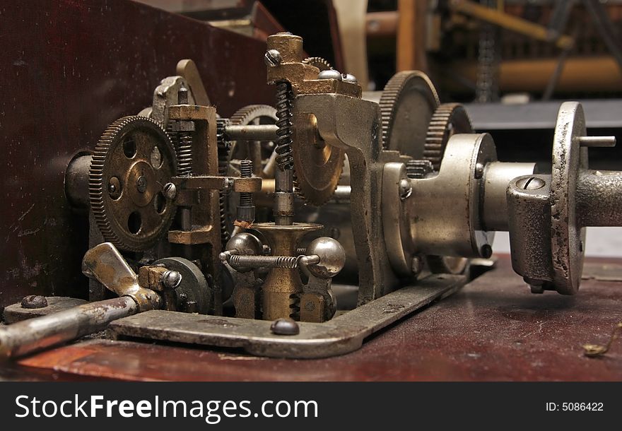 Old clock-work mechanism with cog wheels.