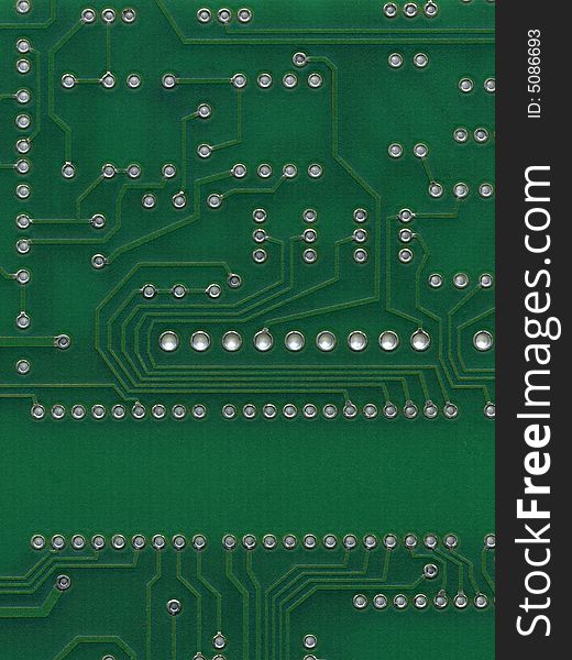 Scan of green circuit board with hole for circuits