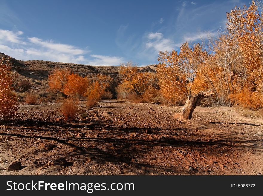 View of the red rock formations in San Rafael Swell with blue skyï¿½s and clouds. View of the red rock formations in San Rafael Swell with blue skyï¿½s and clouds