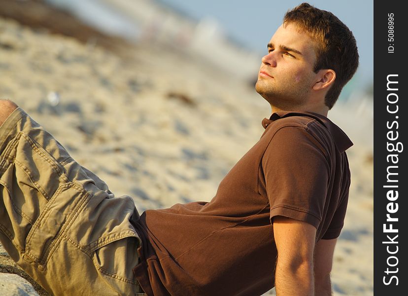 Man Sitting On Sand