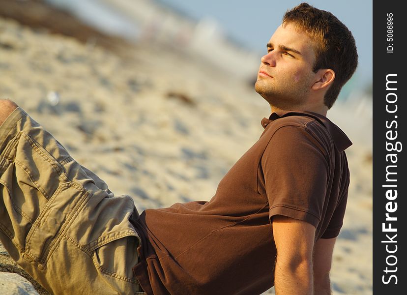 Young man enjoying his day at the beach. Young man enjoying his day at the beach