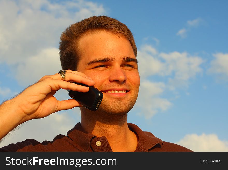 Attractive young man on a cell phone. Attractive young man on a cell phone