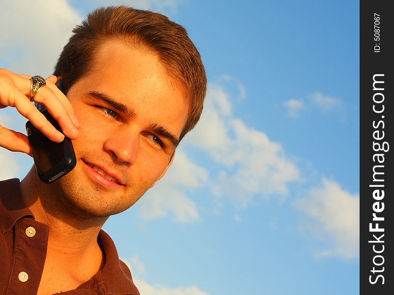 Attractive young man on a cell phone. Attractive young man on a cell phone