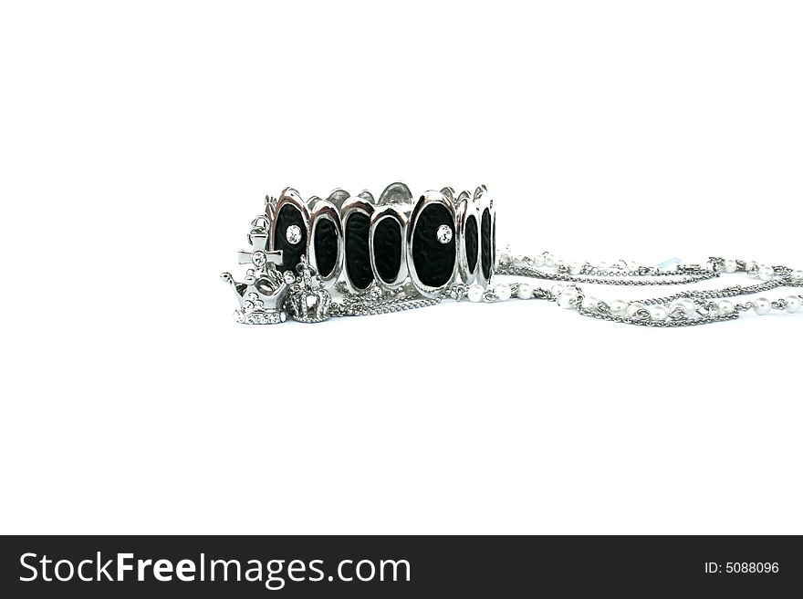 Silver bracelet and crowns isolated on the white.