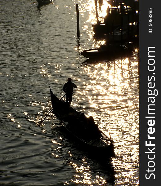 Venice (Italy) postcard: view from top of glinding gondola in Venice, silhouette