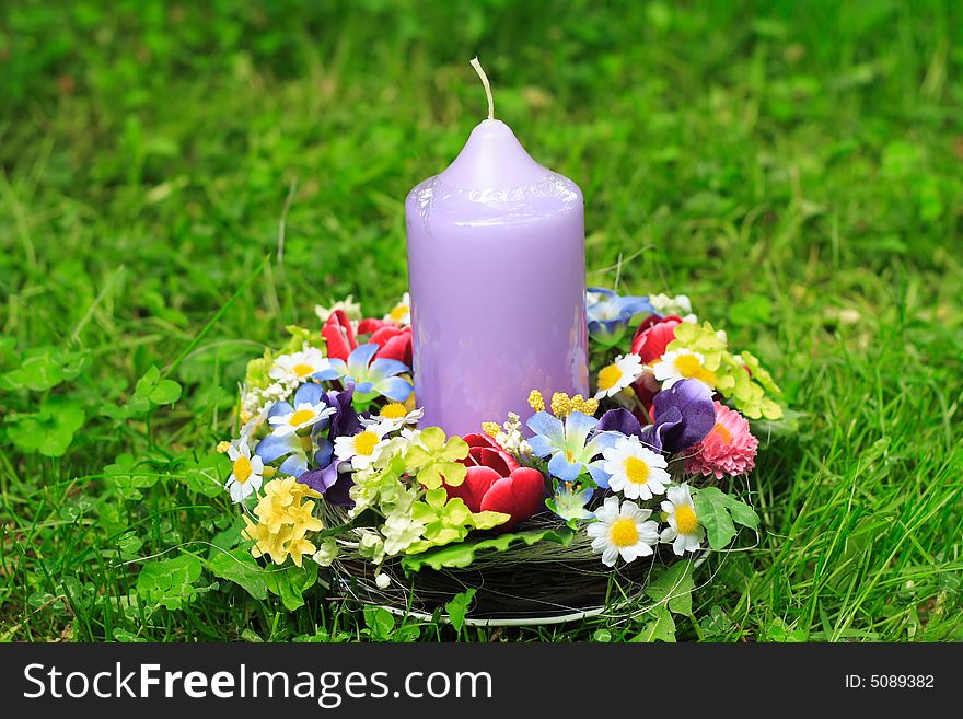 Easter decoration and candle in the garden