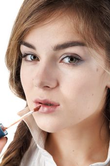 Girl Applying Lipstick Stock Photography Girl Applying Lipstick Stock Photography