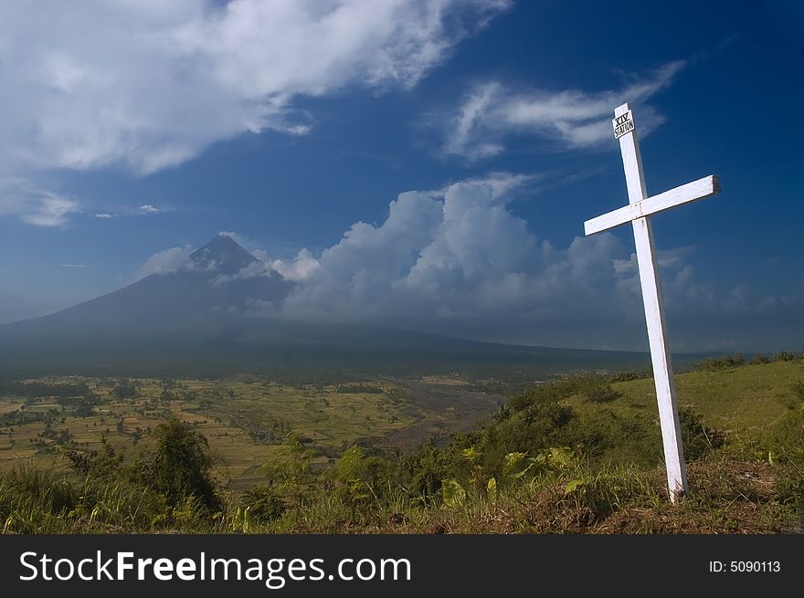 A station of the cross set in front of a volcano. A station of the cross set in front of a volcano