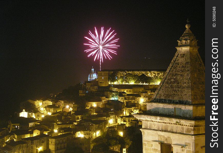 The photo represents at night Ragusa, a splendid Sicilian city and its characteristic it is that we have succeeded in taking the exact instant in which the fire of artifice explodes. The photo represents at night Ragusa, a splendid Sicilian city and its characteristic it is that we have succeeded in taking the exact instant in which the fire of artifice explodes
