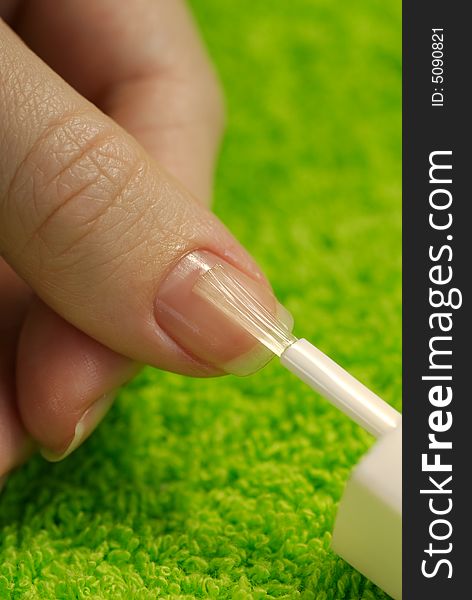 Polishing of thumbnail with nail-care treatment
