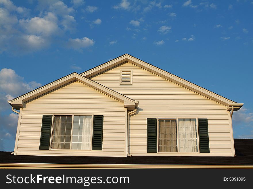 Front of a home with a blue sky. Sharp focus over the entire image. Front of a home with a blue sky. Sharp focus over the entire image.