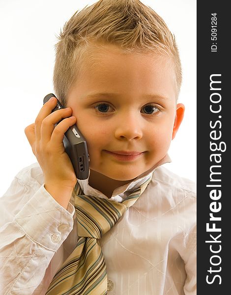 Child talking via cellphone and smiling