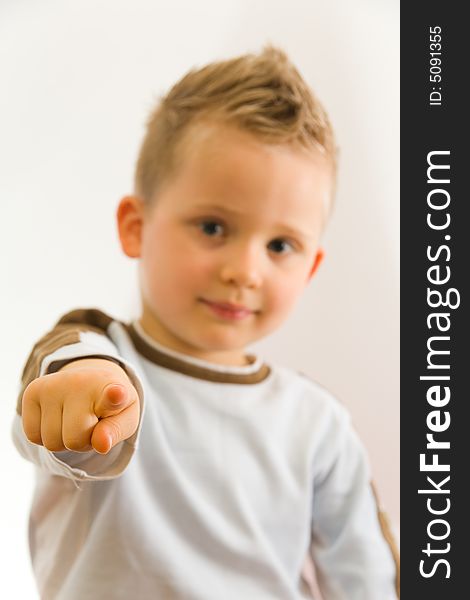 Child showing on somebody by his finger. Child showing on somebody by his finger