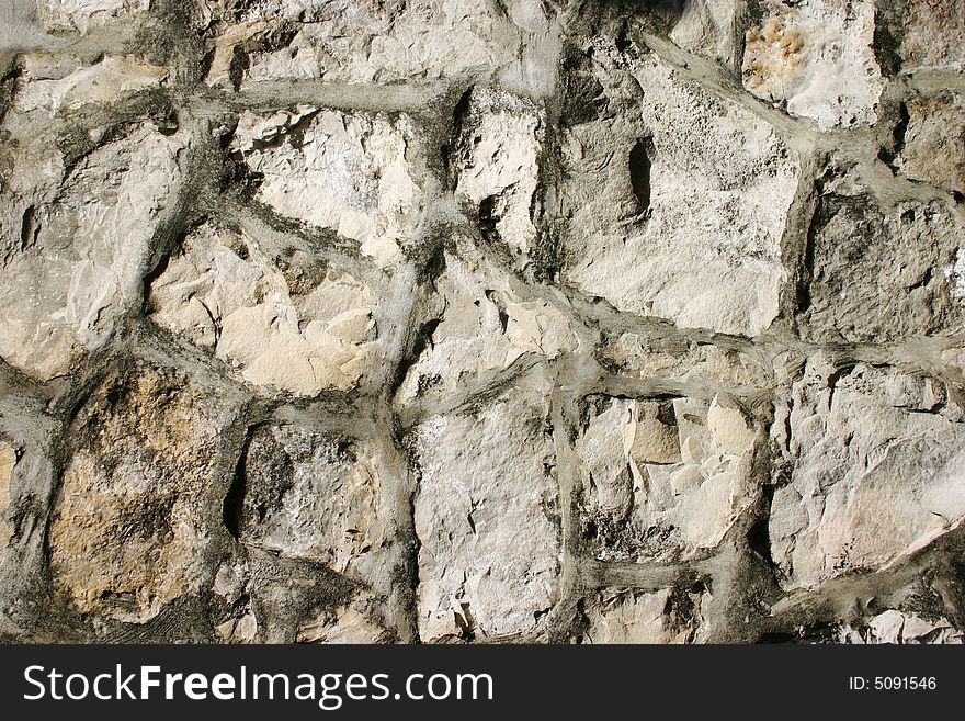 Old wall from stone on daylight