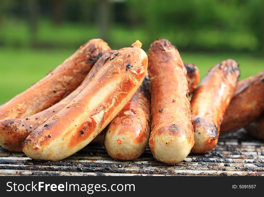 Roasted sausages on the grill. Roasted sausages on the grill.