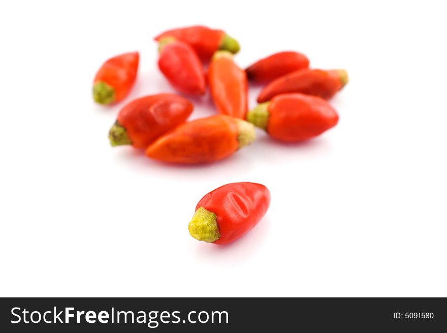 Chili peppers on white background with selective focus