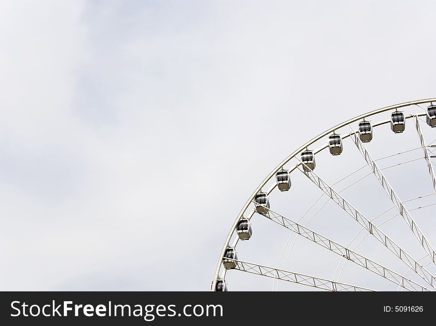 Ferris wheel  against a bright sky