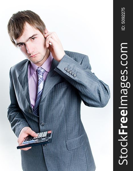 Serious Looking Businessman With Calculator