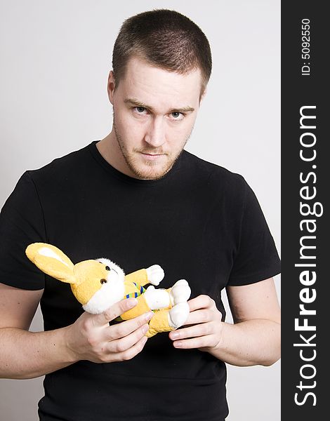 Man holding a toy bunny. Man holding a toy bunny