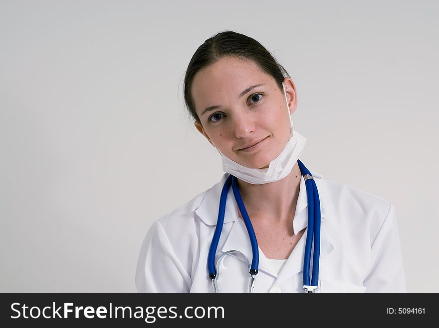 An isolated portrait of a female medical intern. An isolated portrait of a female medical intern.