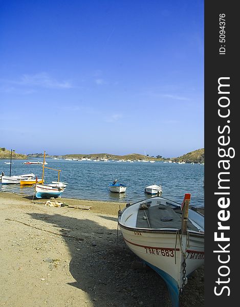 Fishing boats lying on the beach of a bay