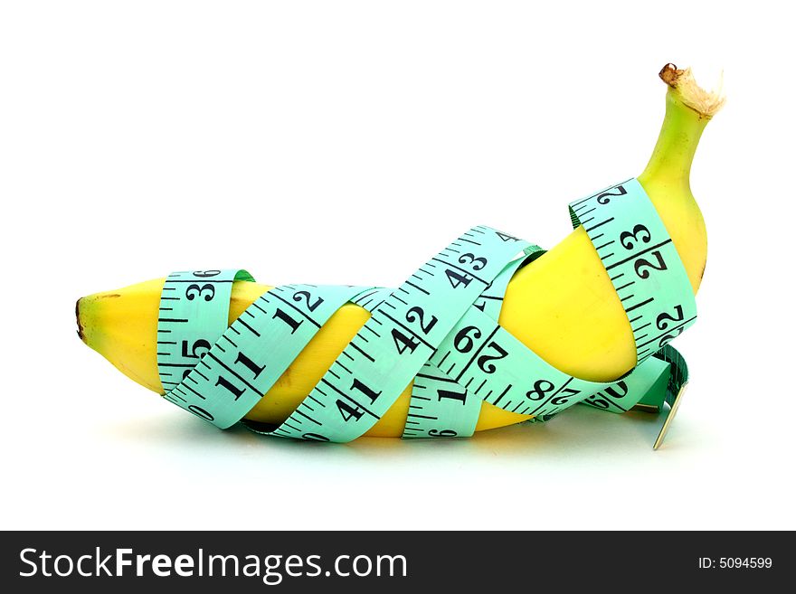 Green tape measure wrapped around a banana. Green tape measure wrapped around a banana