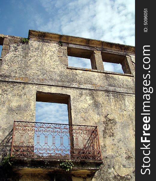 Old abandoned house width blue sky as background
