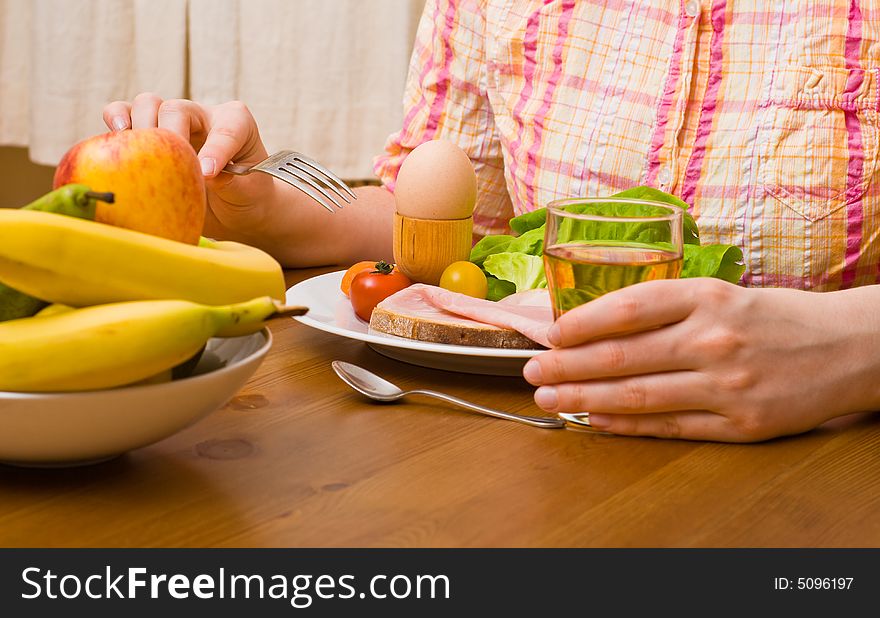 Woman eating snacks. Fruits, vegetables, bread, egg, ham etc. Woman eating snacks. Fruits, vegetables, bread, egg, ham etc.