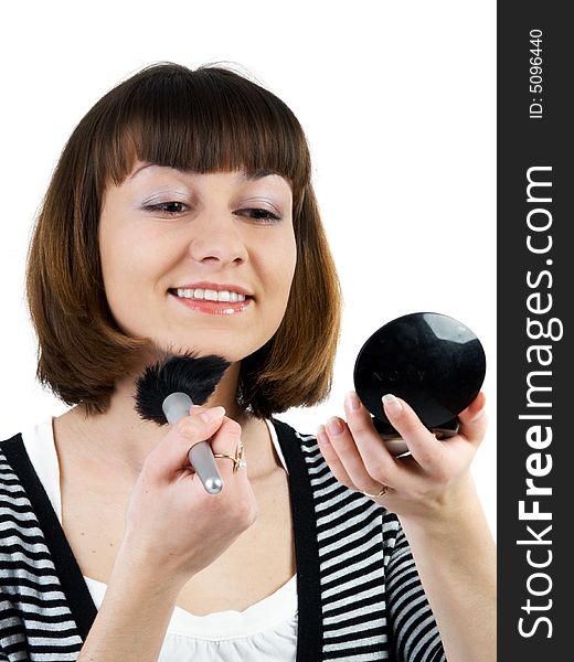 Girl applying powder looking to mirror