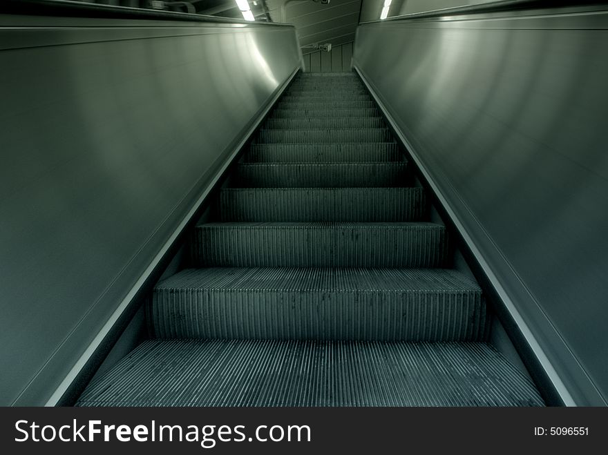 Wide-angle shot of a moving-stair in motion. Wide-angle shot of a moving-stair in motion