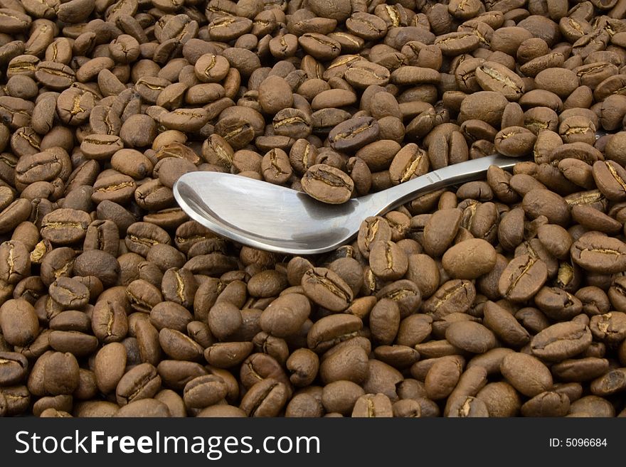 Coffee beans and spoon close-up