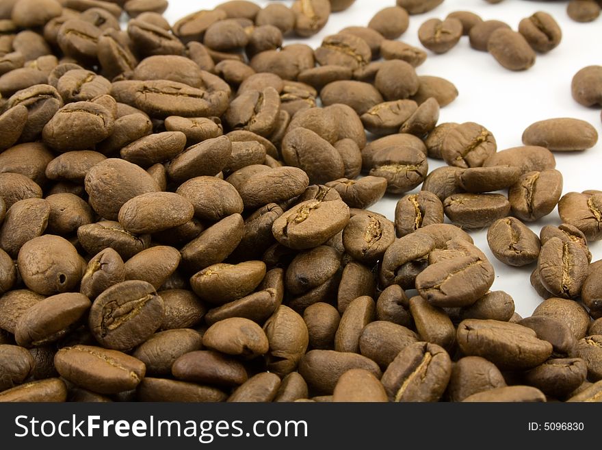 Coffee beans close up isolated on white