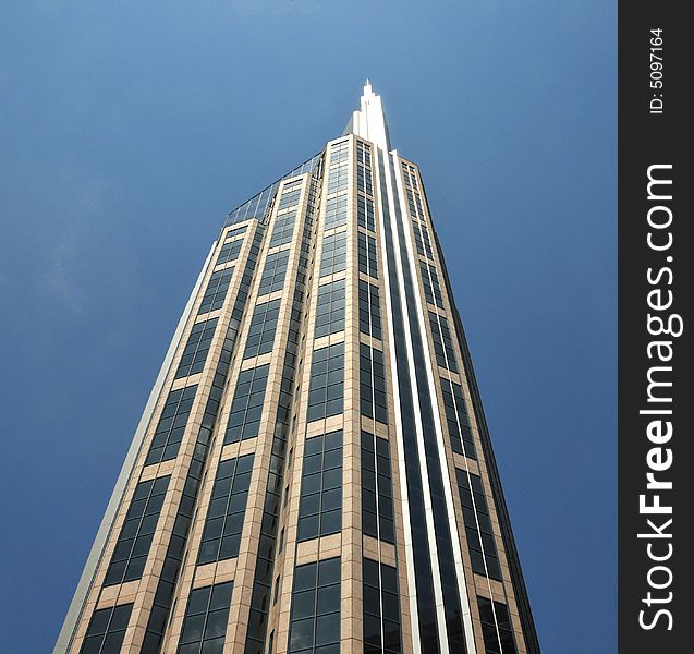 Tall modern glass and steel office building. Tall modern glass and steel office building