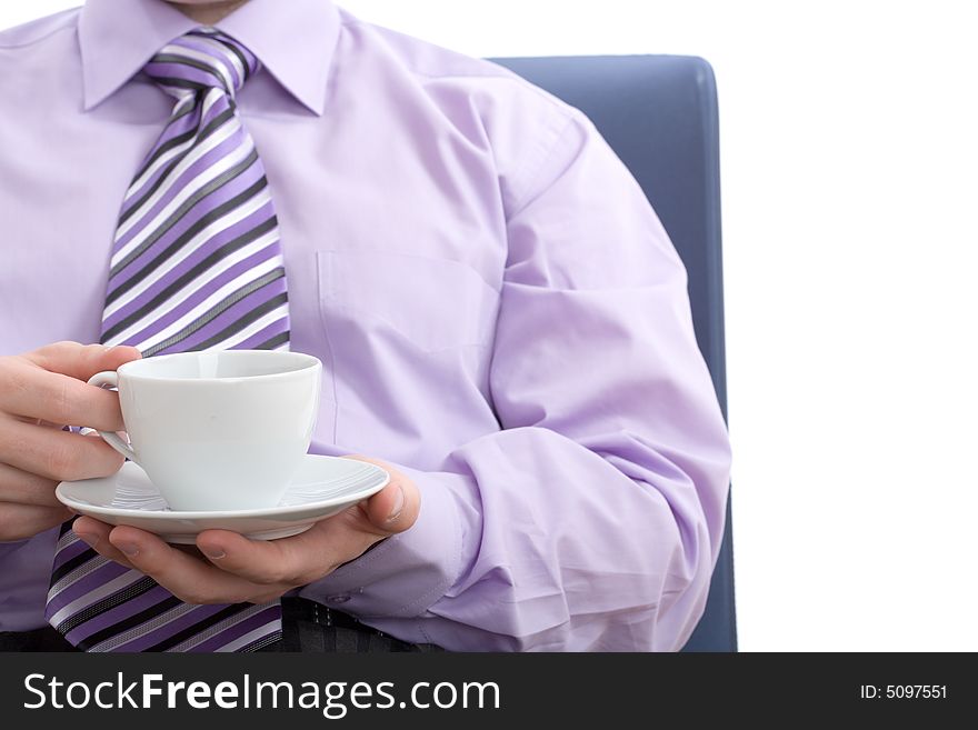 Young businessman drinking a nice warm cup of coffee at break. Isolated on white background. Young businessman drinking a nice warm cup of coffee at break. Isolated on white background