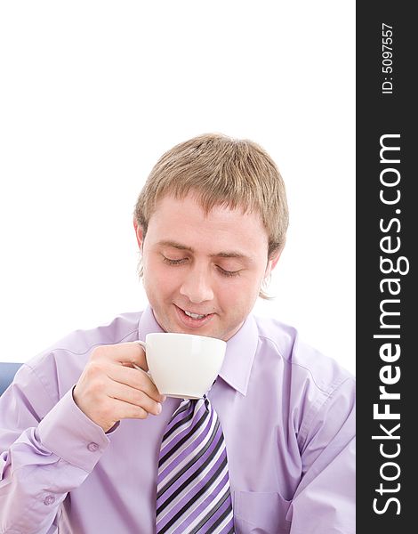 Young businessman enjoying a nice warm cup of coffee at break. . Isolated on white background. Young businessman enjoying a nice warm cup of coffee at break. . Isolated on white background