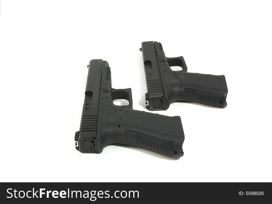 2 black handguns isolated on a white background. 2 black handguns isolated on a white background
